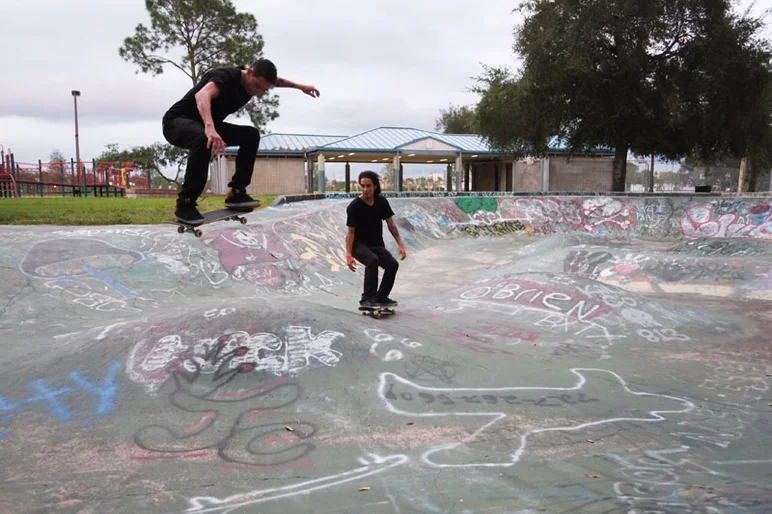 Yonis on a big ol' switch ollie with Manny creepin' tailgate.<!-- Booze Cruise: September 2012 -->