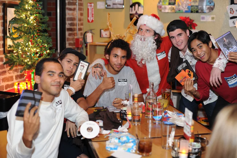 Josh, Treshan, Jared, Matt, and Uncle Sam in a big old drunk Santa gifting circle.<!-- SPoT Employee Christmas Party at The Bricks 2012 -->