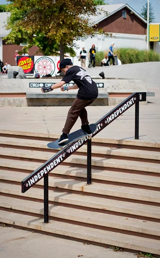 <!--wwpa-fri-->

Moving the day along just up the hill, street Qualifiers begin...  Rory Doran gets the first heat started with a Front Feeble down the rail.