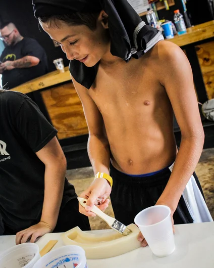 <!--consproject-->

The first step is to coat the molds in something to help release the dried Concrete. The kids were stoked to work on a hands on project like this.
