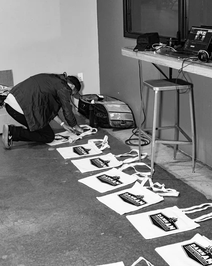 The man behind the madness, Paul Zitzer. He hand screened these tote bags himself, flew to LA, then loaded them with prizes for our podium winners.

<!--damnamla2023-->