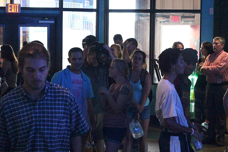 <!--consxpolar17-->

Skaters and girlfriends of skaters wait patiently for the video to start.