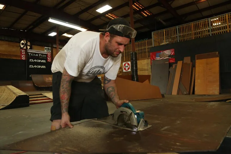 <!-- 2013coursedemo -->
The look of concentration says enough about this photo. There’s no way I’d be able to get through this much demolition without slipping and cutting a finger off or driving a nail through my hand somehow. 