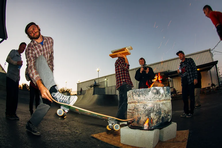 <!--OMBJ16-->

Tanner believes in safety first. Here he is sweeping away the hot embers.