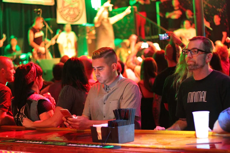 <!--PRO15FRINIGHT-->
Think he is downloading an app on how to enjoy a concert?