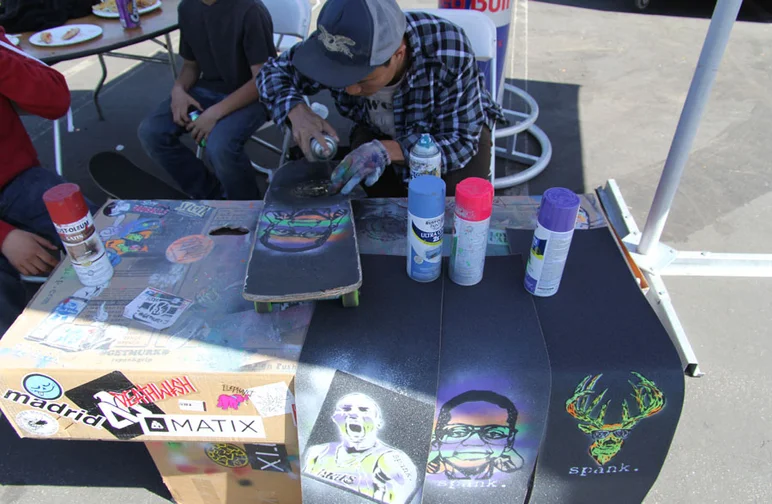 Our new friend Lawrence spraying up some fresh Spank Grip.<!-- Damn Am Costa Mesa 2013 Presented by Volcom -->