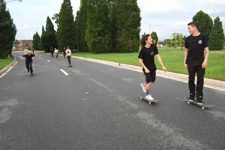 The streets are still wet, but we're on the roll anyway.  Jereme Knibbs and Yonis lead.<!-- Booze Cruise: September 2012 -->