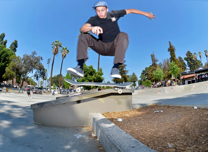 <!--dala153-->

Coming in 10th place, Frankie Heck plays the long ball with a Kickflip over some mulch.