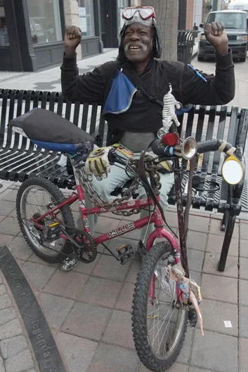 The streets of Ybor have the best parade of characters.  This nice man insisted on showing his muscles when I asked to shoot a photo of his interesting setup on his bike.<!-- Moat Water Deck Release Party at SPoT Ybor -->