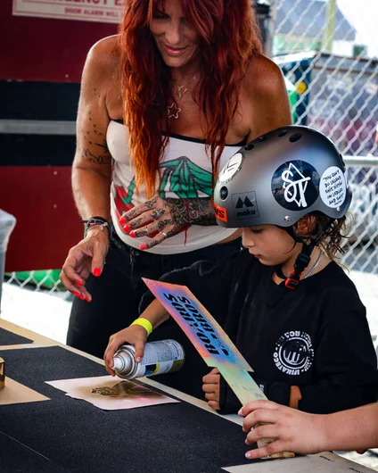 The Boards for Bros fam was in the Courtyard letting kids give their boards some custom details.

<!--schoolsoutjam2023-->