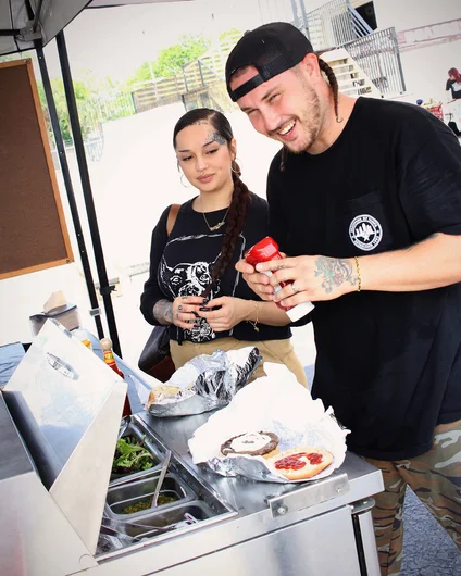 <!--sr19photos-->

Cash may have slammed on his face pretty hard during the contest, but he’s all smiles anyway. Oh yea and that burger came from the Bricks tent. Thanks Bricks Squad for cooking all day!