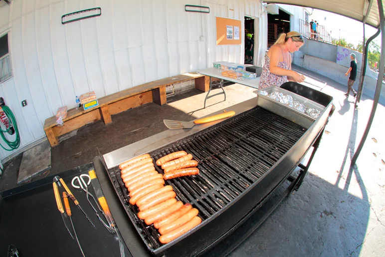 <!--eotmapr16-->
Outside, Jeni was getting the burgers and hot dogs prepped. They’re free for employees but all we ask is you donate at least a dollar to Boards for Bros and you get some!
