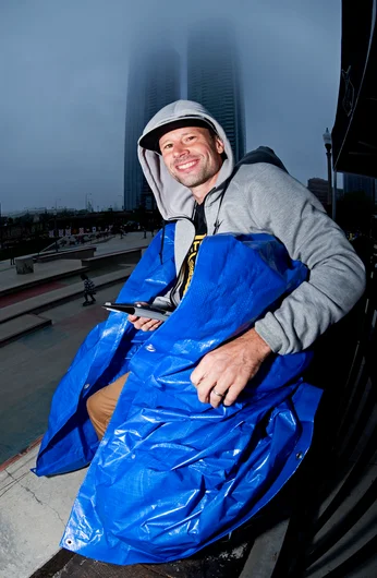 <!--dachiday2-->

Guest pro judge, Chany Jeanquenin having a hard time with the weather grabs a tarp to ease the pain.