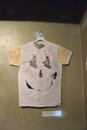 <!--bokmaartshow-->

Paul Urich’s one of a kind hand painted tee shirt “Don't be a sad Pierre “. That grin looks just like Justin’s. $125. <a href=