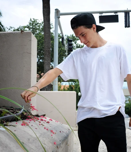 <!-- FranksForNothingLakeLand -->

Instead of brushing away the debris from a spot like Abdias did, Knibbs decided to beautify his with some lovely pink flowers. The color almost matches his Nikes.