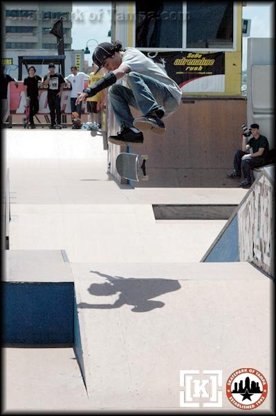 Greg Myers - kickflip over the bank to bank