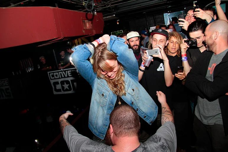 <!--pro14night2-->

At one point, Action ran off stage, still rapping, and into the streets of Ybor.  Then he came back and went up to V.I.P., killing verses from the balcony.  