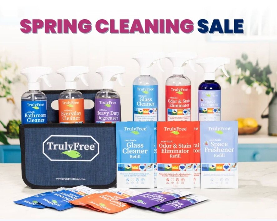 Truly Free Home non-toxic cleaning products and a cleaning caddy.