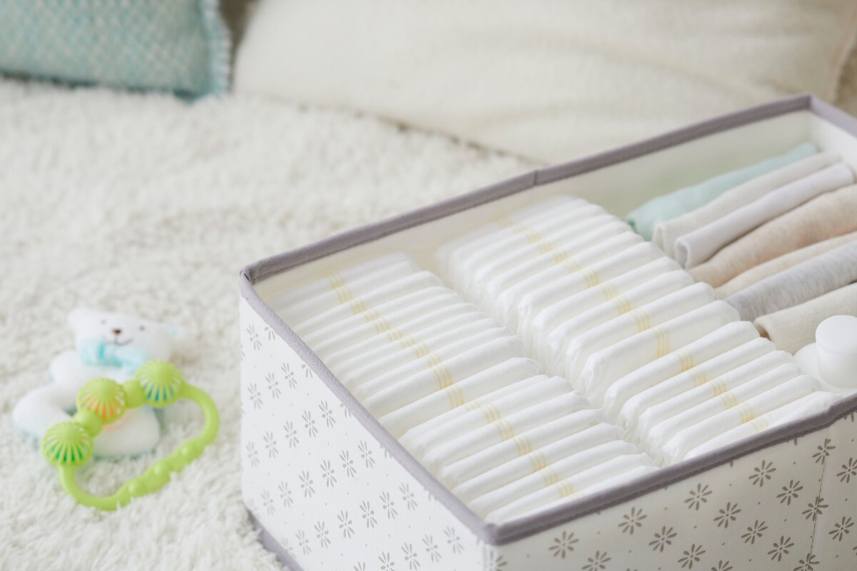 Baby diapers organized in a bin