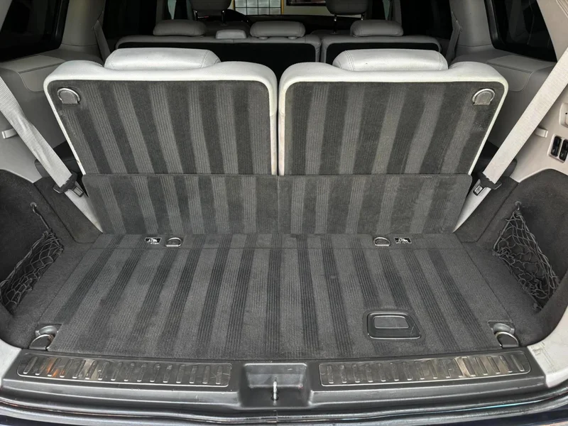 Detailed SUV cargo area with clean carpet and rear trim