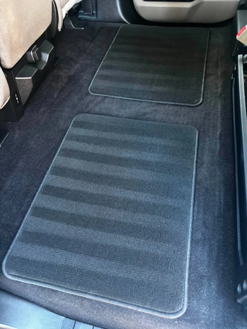 Clean Range Rover driver footwell after an interior detail