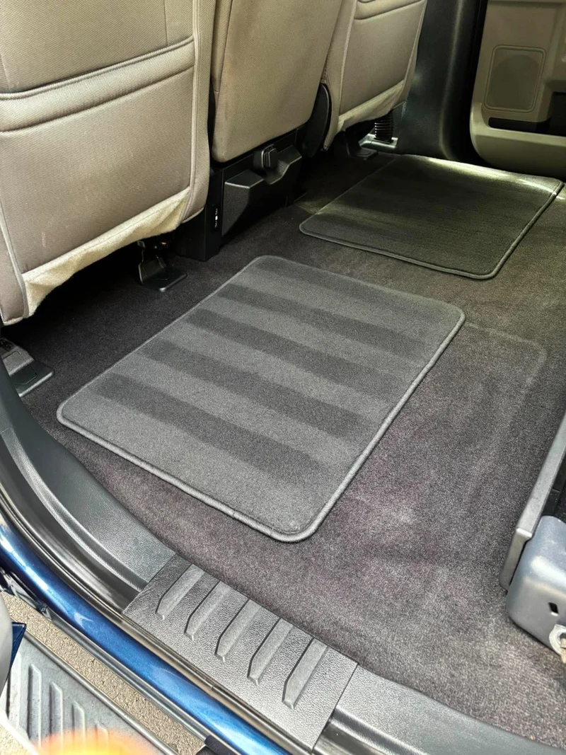 Freshly cleaned rear footwell with fitted carpet floor mats