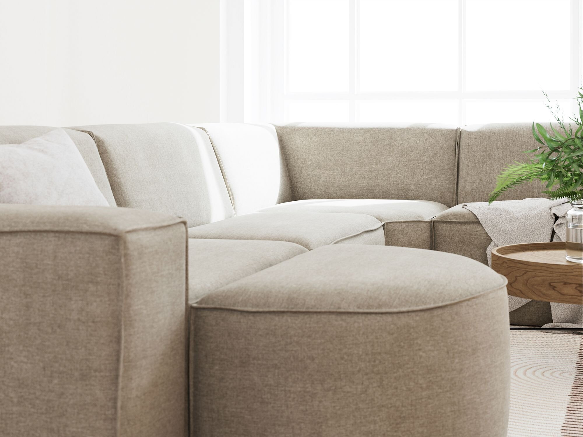 Stue med meget lys og fokus på Quadrato sofaens detaljer