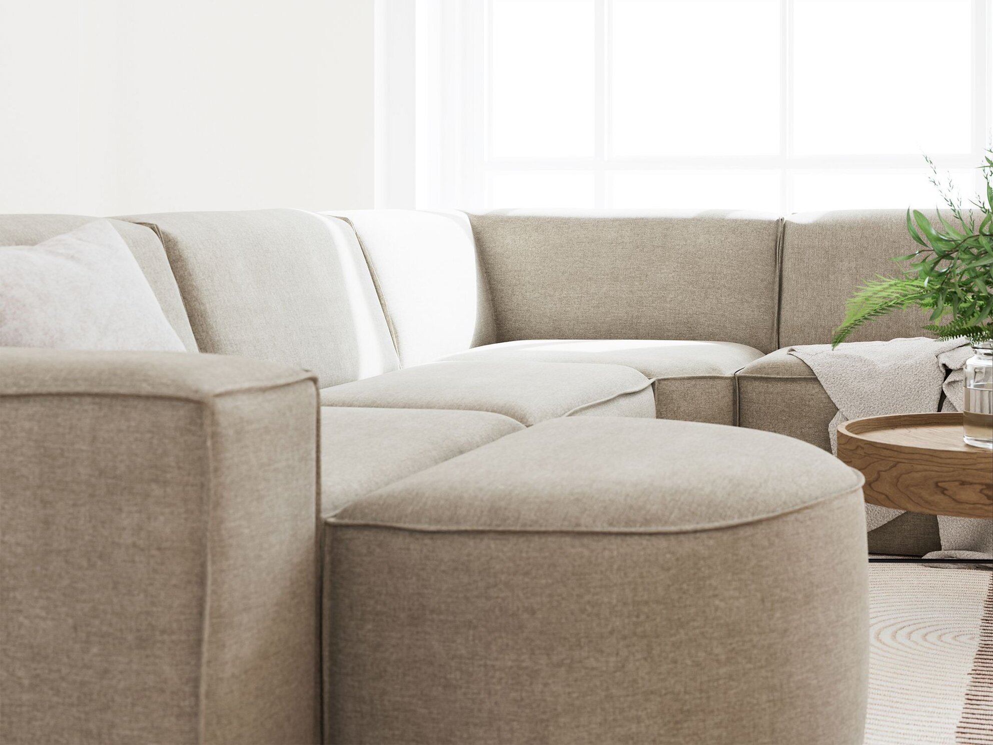 Stue med meget lys og fokus på Quadrato sofaens detaljer