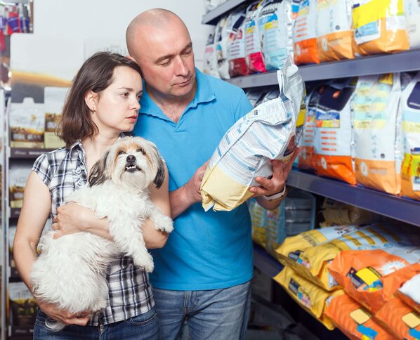 Couple shopping for a bag of dog food