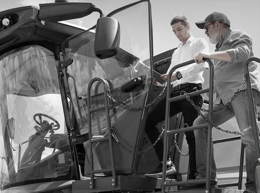 farmer and dealer on combine harvester