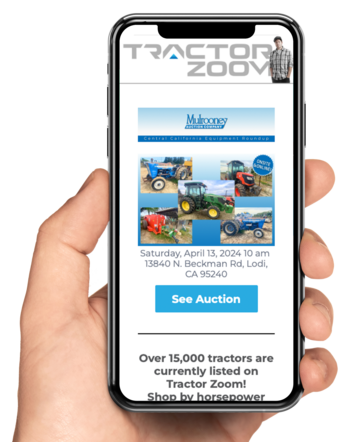 hand holding phone with Tractor Zoom email