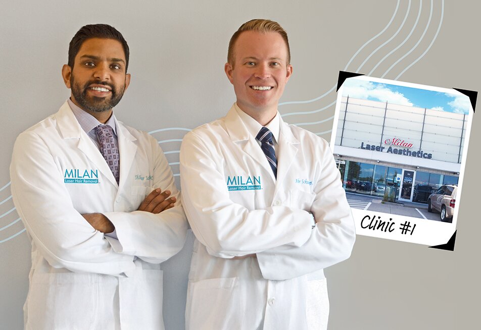 Abe and Shikhar, Milan Laser's two founders, standing in lab coats next to their number 1 location