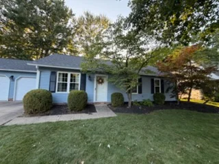 Painted Ohio home exterior with clean blue siding and white trim