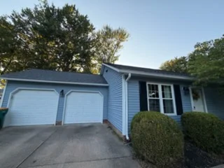 Painted blue house exterior and garage