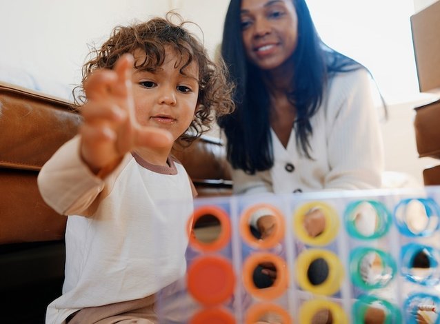 Mother and son playing with Lovevery toy