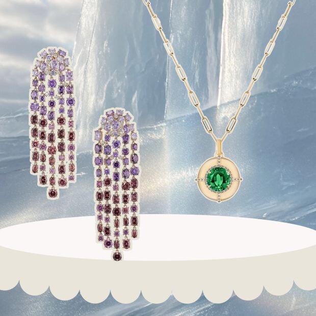 A pair of chandelier earrings with a gradient-hued array of amethysts and pink tourmalines and gold vermeil, next to it is a gold and emerald diamond pendant necklace. both in front of an icy/snowy background.