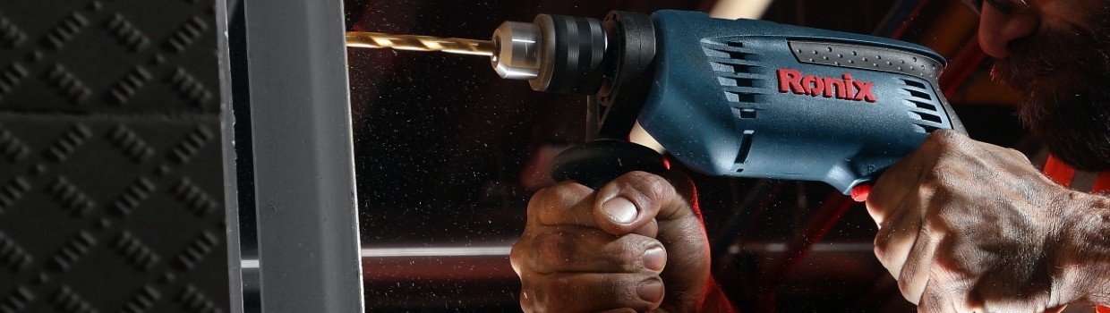 Image of a drill working on metal
