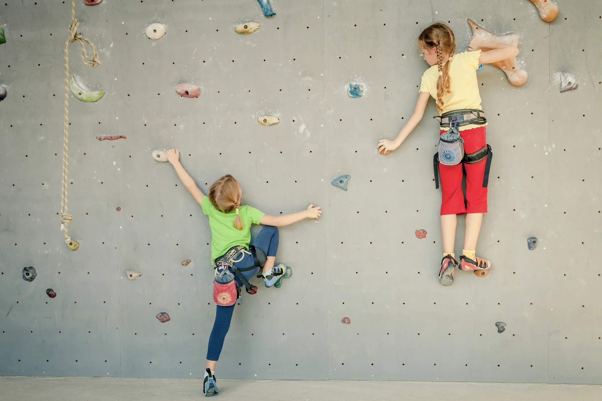 Students climbing walls