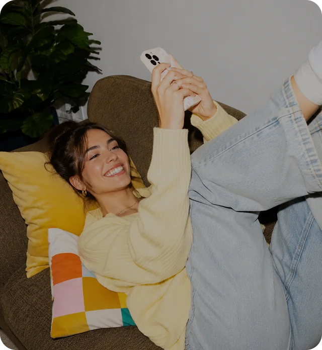 360 TikTok Solution: a relaxed seller browsing TikTok Shop on her phone