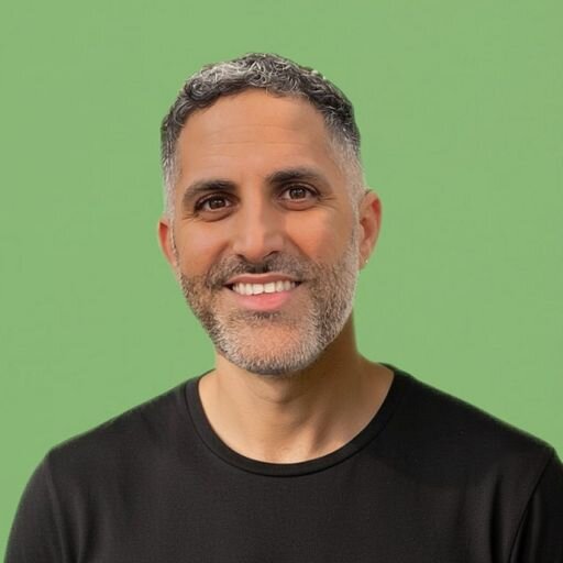 A profile photo of Eliran Laniado on a green background.