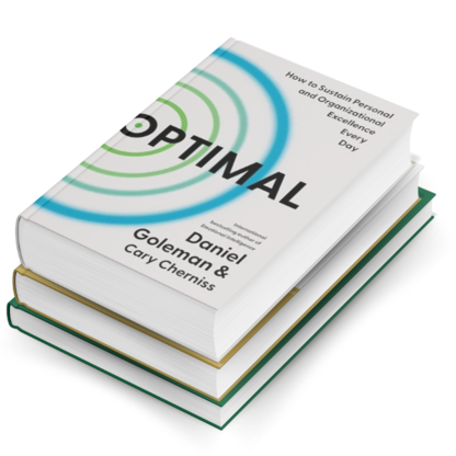 Stack of 3 books with Optimal on the top.