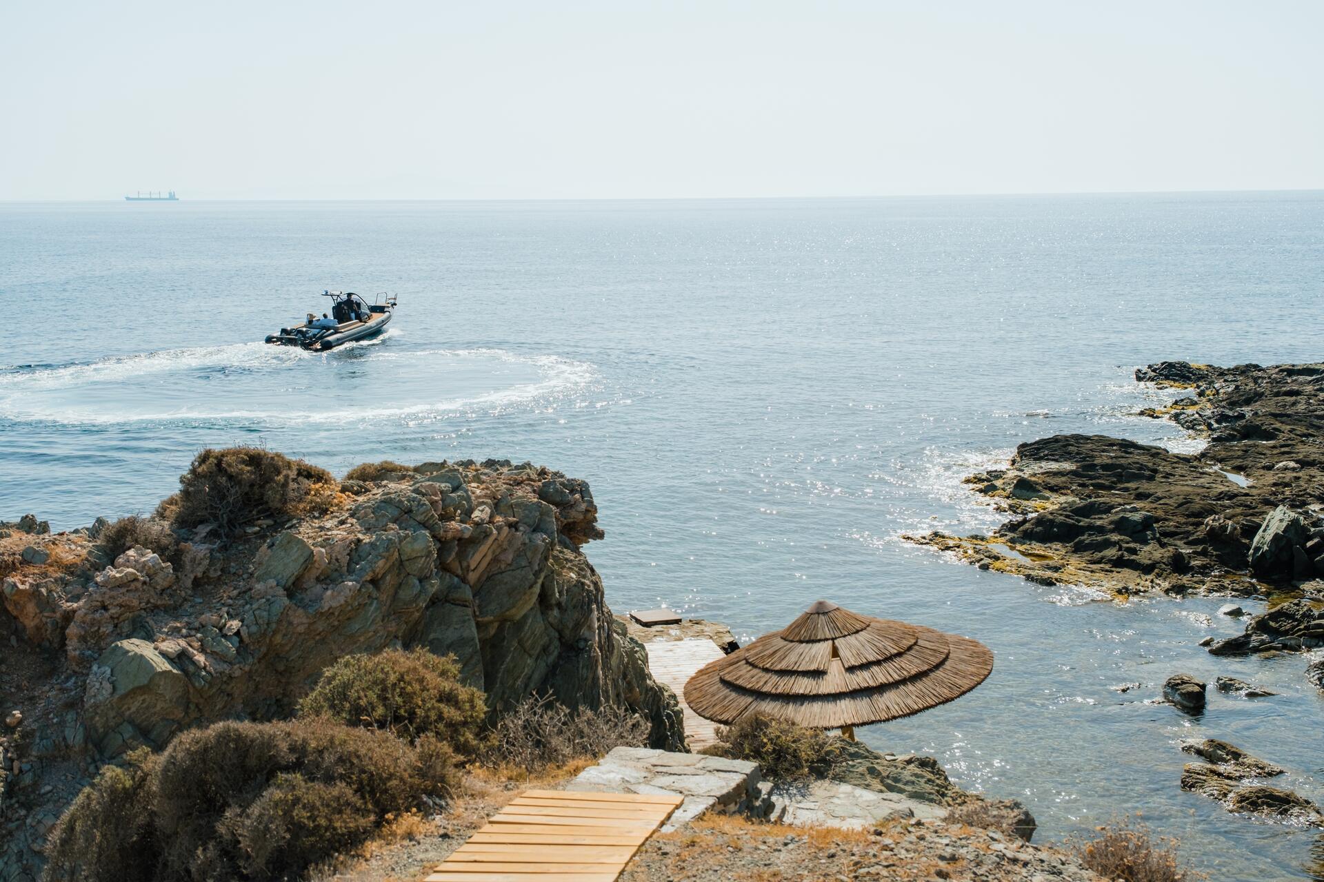 fishing boat travelling on the sea from the cyclades island of syros