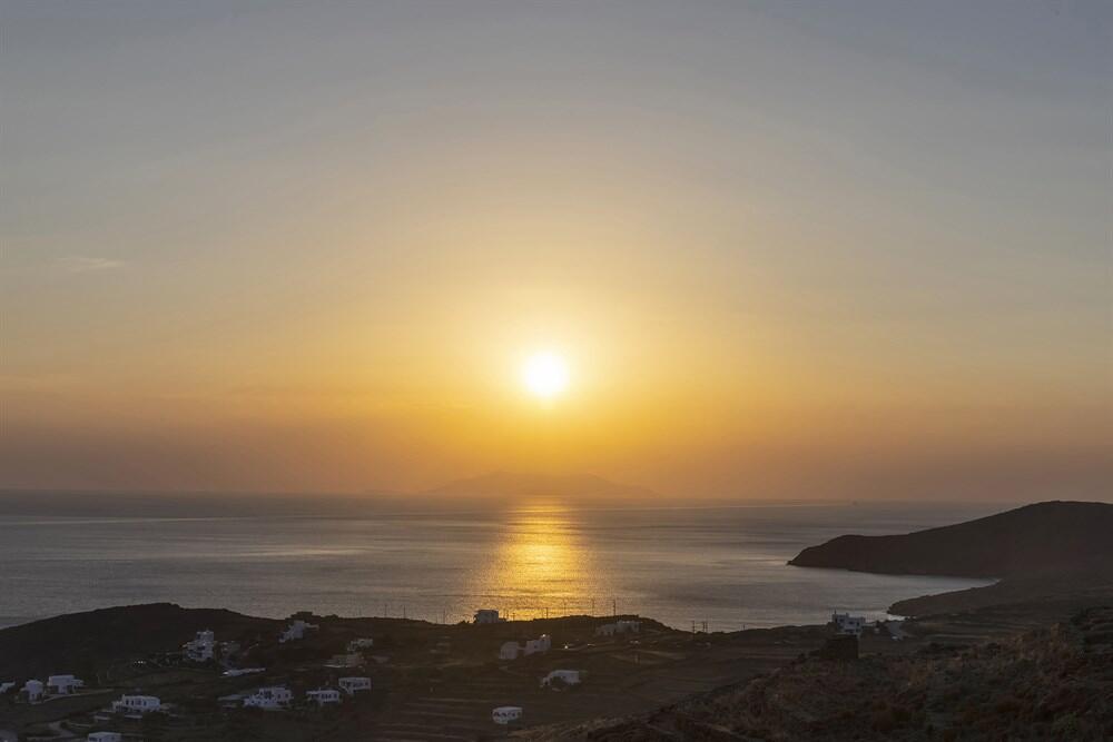 sunset in tinos, cyclades islands, greece