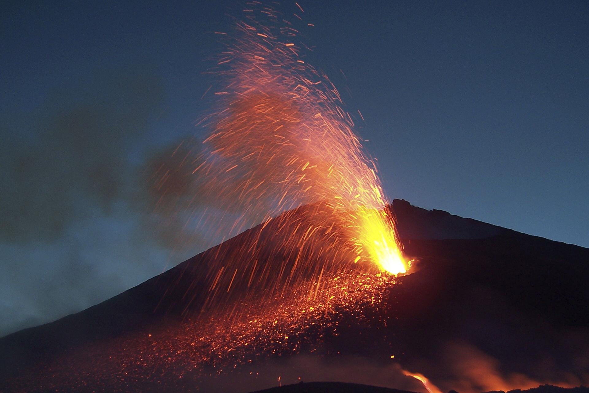 An incandescent eruption of molten lava.
