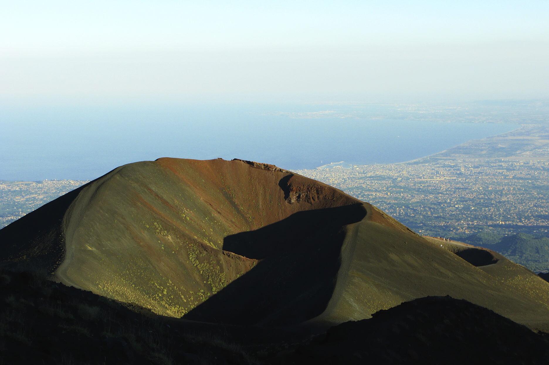 One of numerous craters on Etna, with Catania far down below.