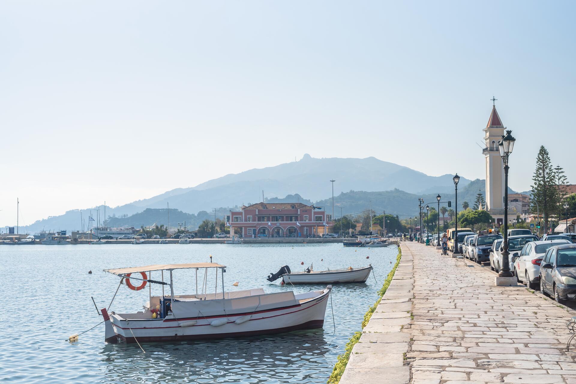 a handful of boats pulled up to the pier in zakynthos town
