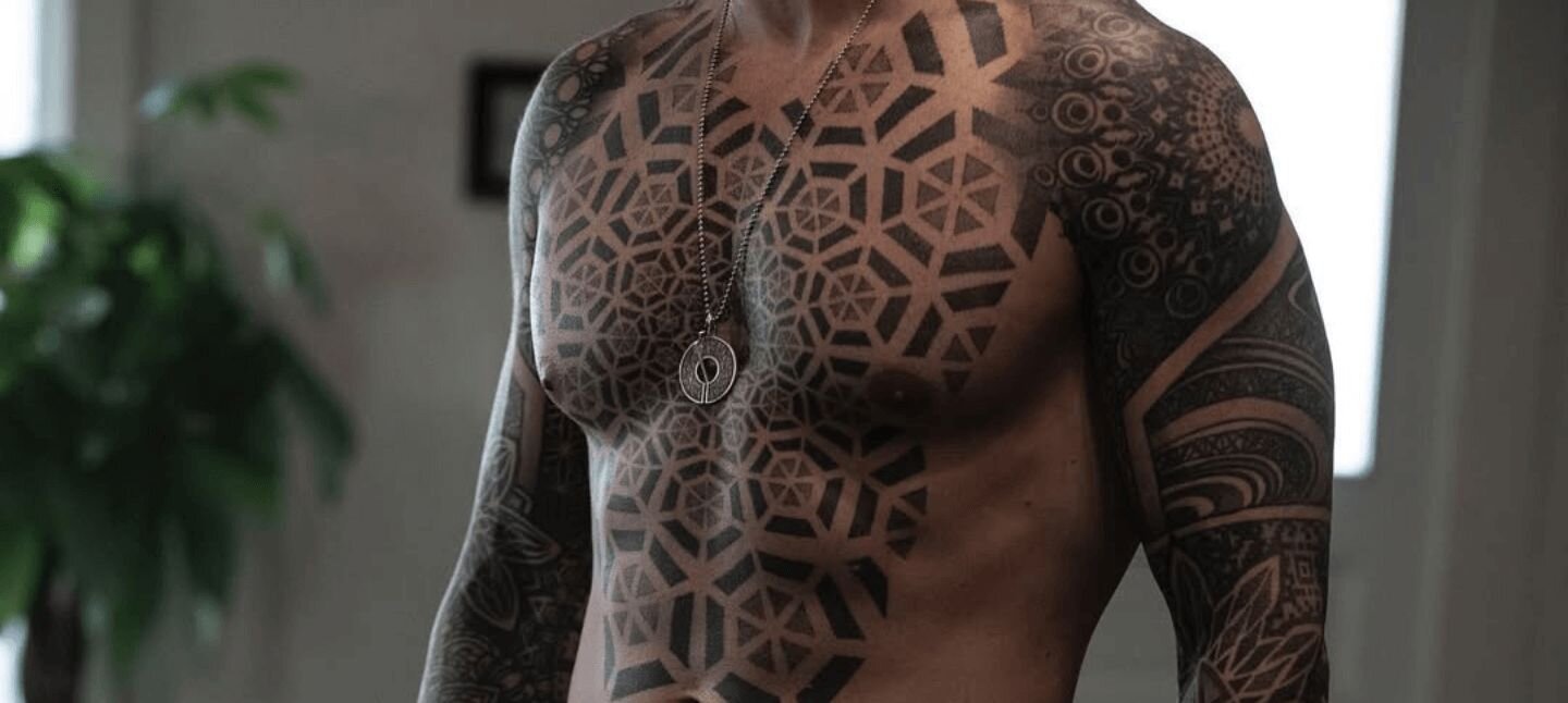 Geometric Tattoo Design on Man's Chest