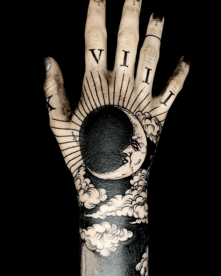 Blackwork Tattoos of moon and sun on hands