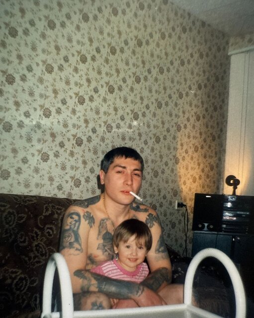 Tattooed man with baby
