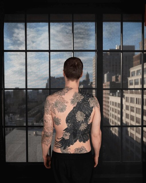 Black Work Tattoo Design of Bird on Man's Back